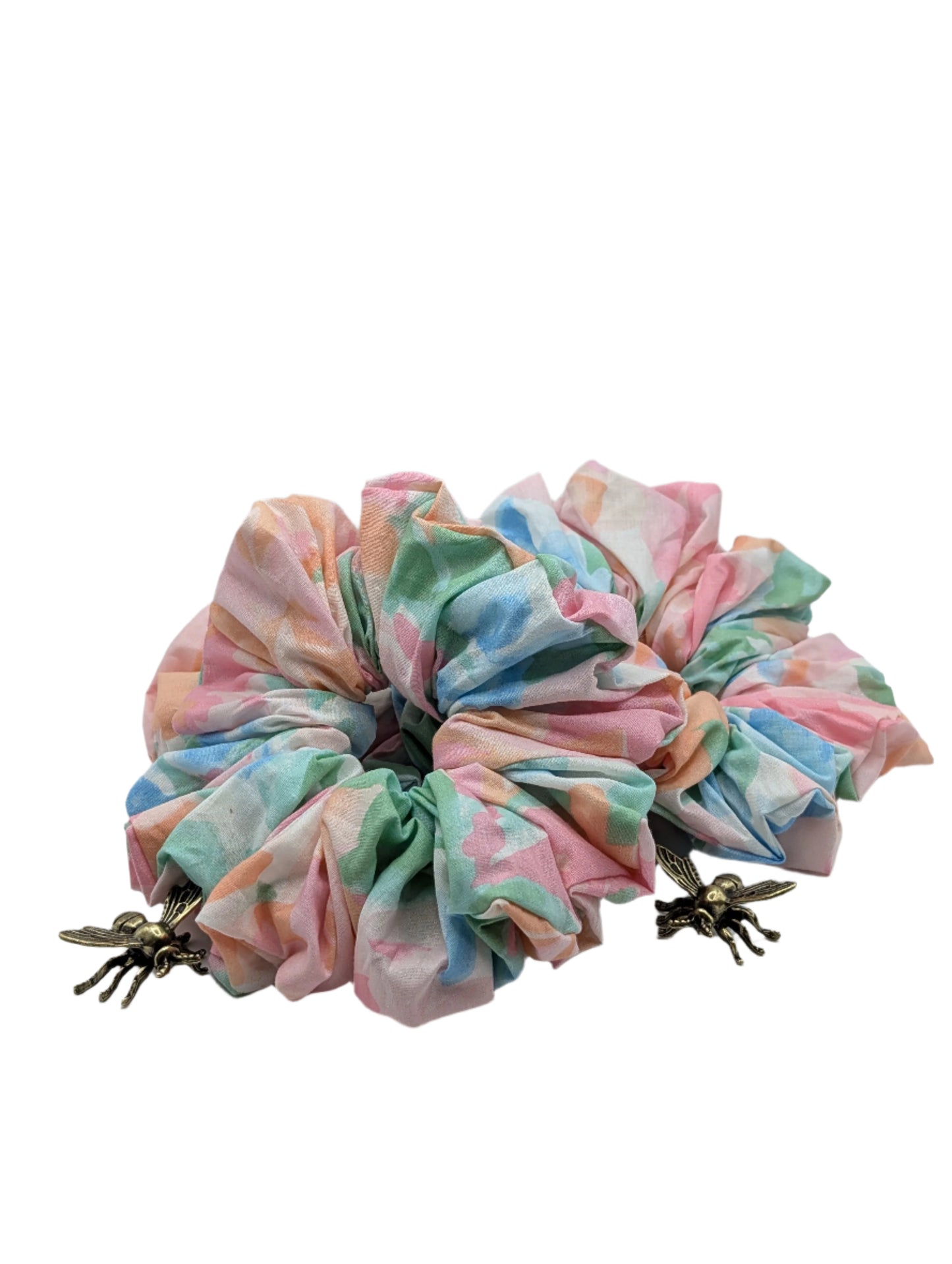 Oversized multicoloured 90s print scrunchie on a white background